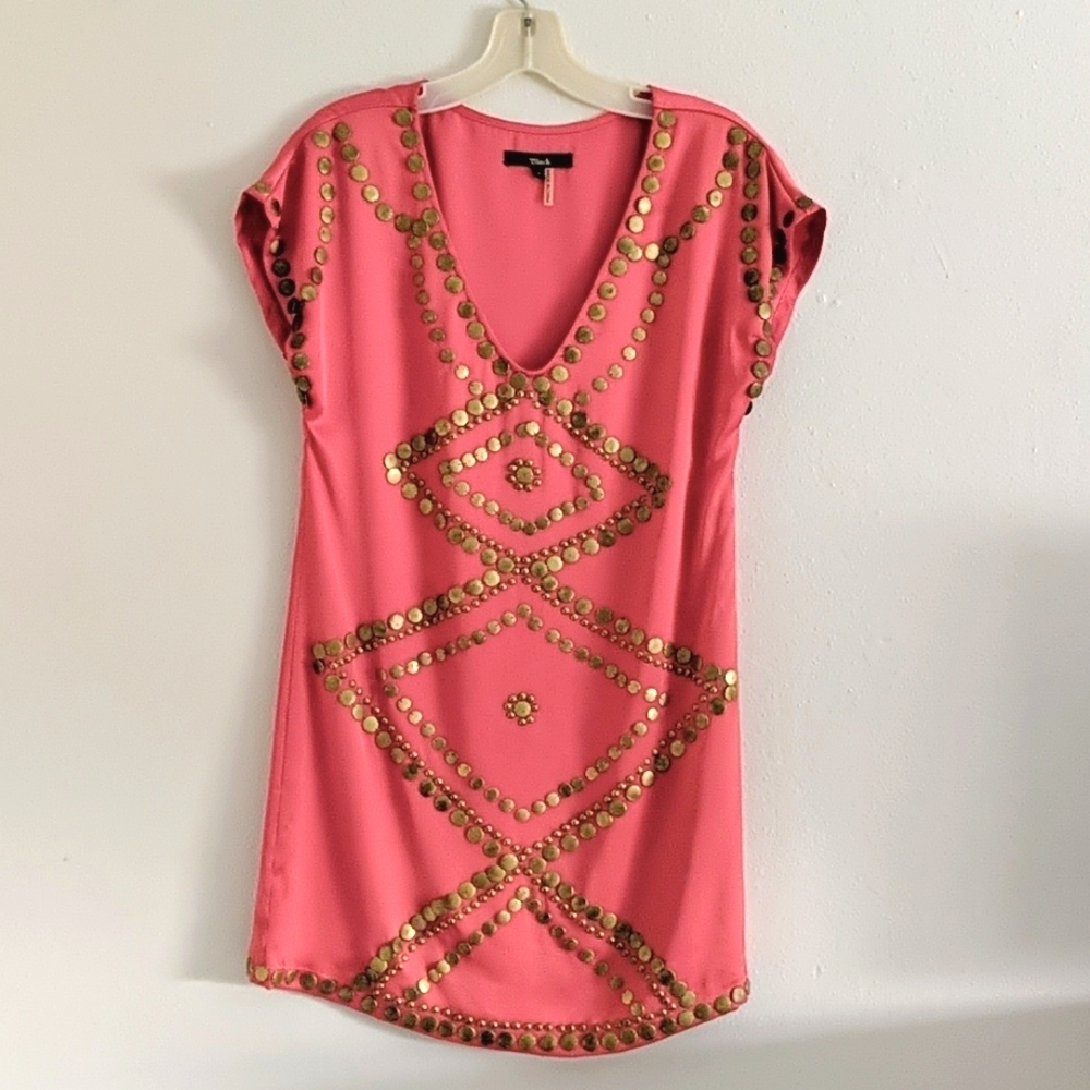Coral dress with brass embellishments